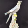 BOURDOIS et BLOCH - Perroquet bleu en porcelaine