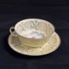 LIMOGES  - Grande tasse à thé au décor doré et floral